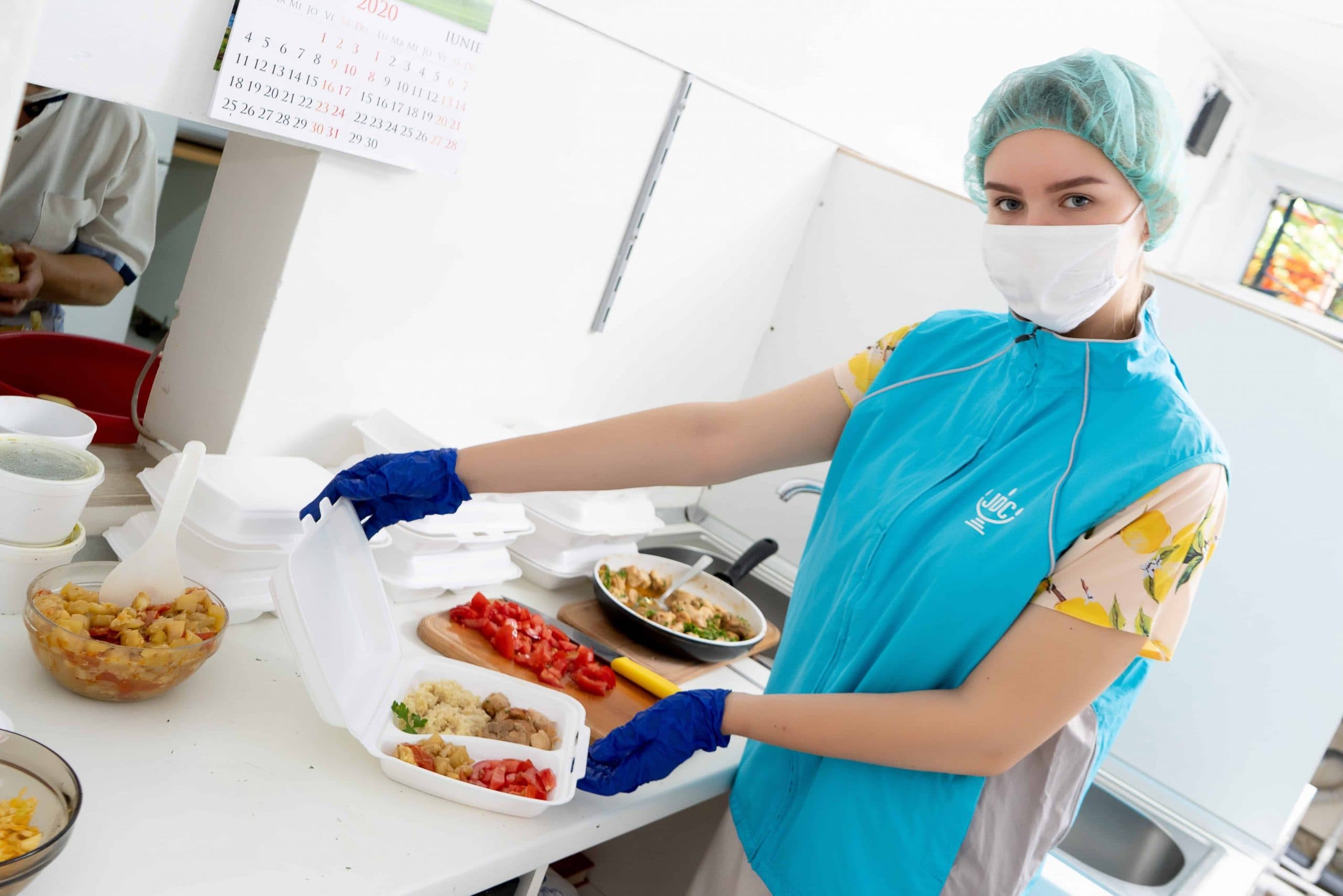 Kaya Rybak, a Jewish Teen in Chisinau, Moldova, shows off one of the lunches she and other volunteers prepare and deliver to local elderly Jews who cannot leave their homes.