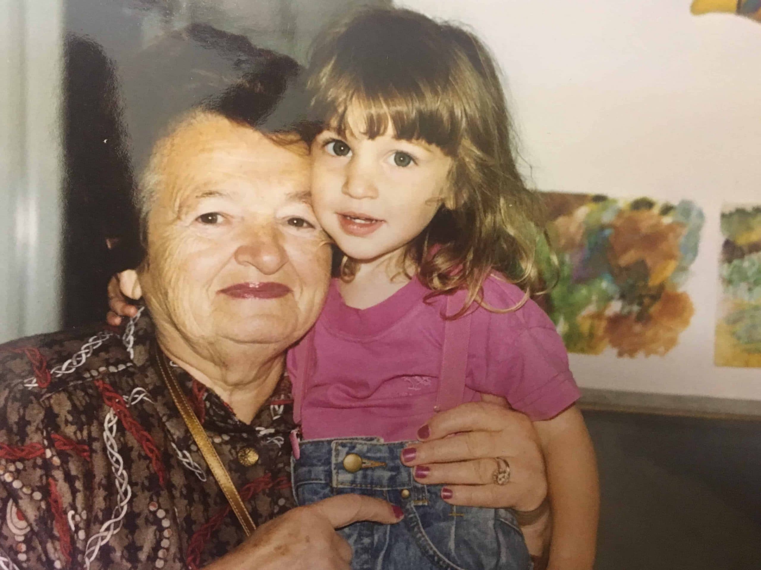 Taryn Silver as a young child hugging her grandmother.