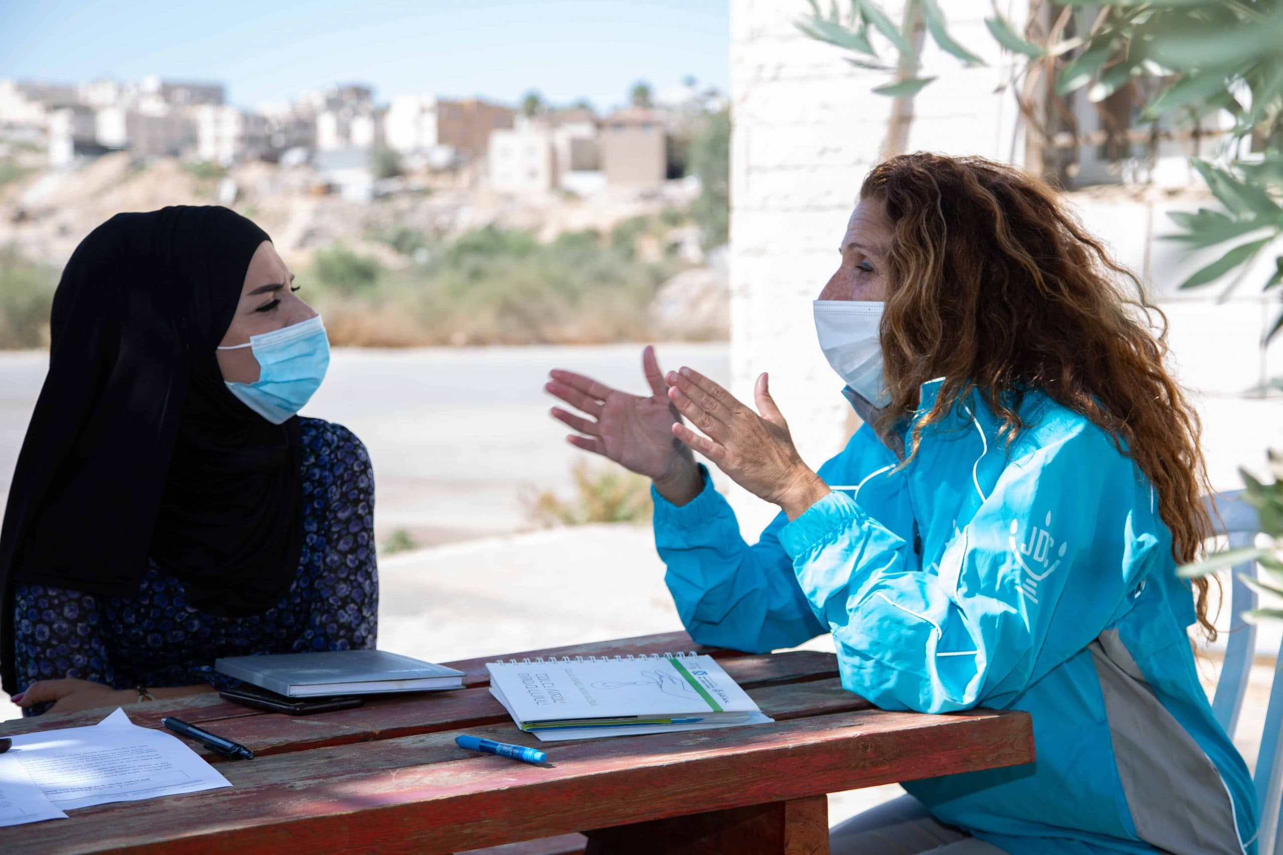 A JDC professional from Families First works with an Israeli Arab woman.