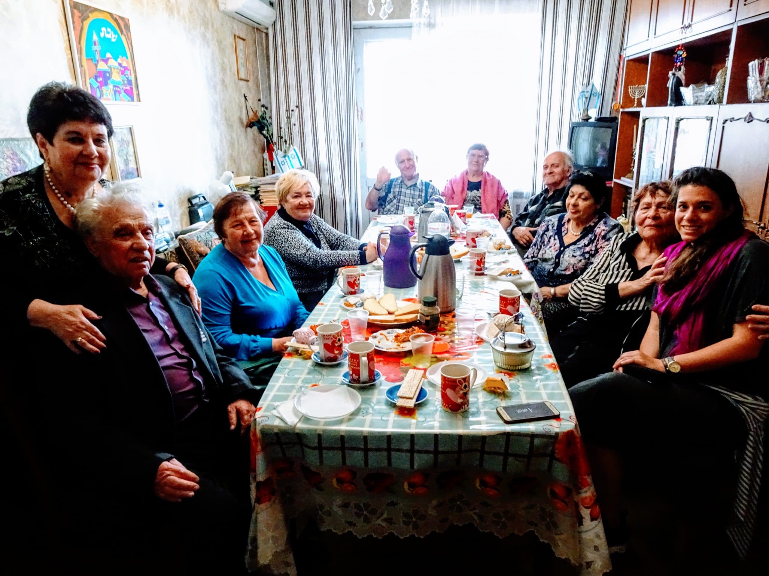 Jessica Katz (far right) visiting with elderly Jews in the former Soviet Union. Katz, along with Joshua Yudkin and Sarah Tagger, were selected to be JDC Entwine Ralph I Goldman (RIG) fellows, a premier leadership opportunity awarded to one person annually.
