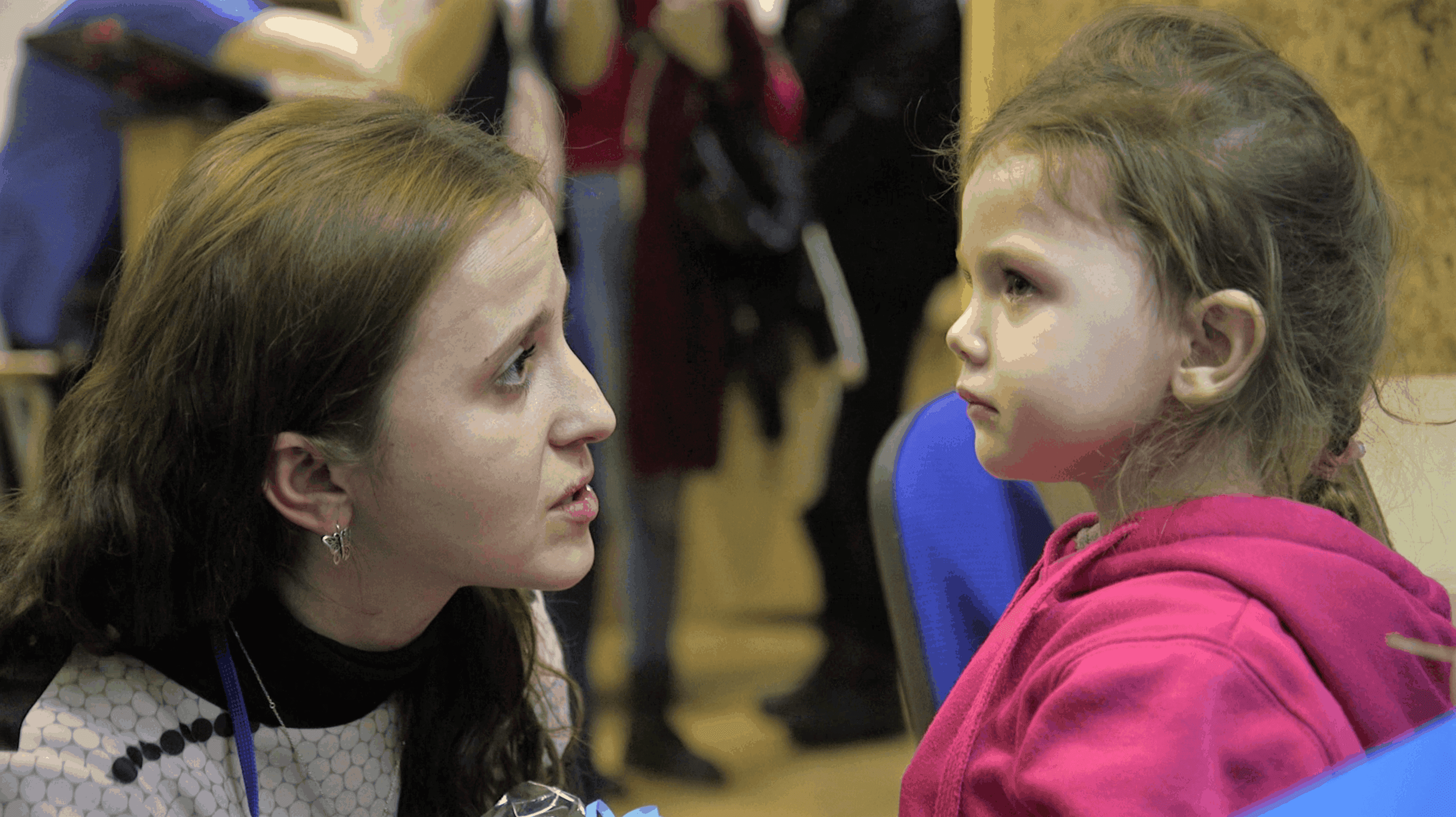 Yulia volunteering with a young child