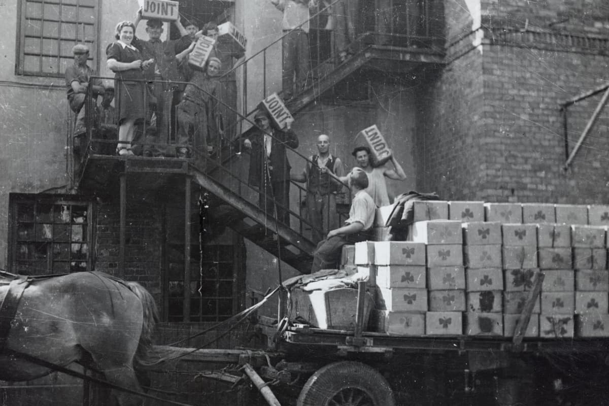 Boxes labeled “Joint” are transported to a warehouse in Warsaw, Poland, ca. 1946-1947.